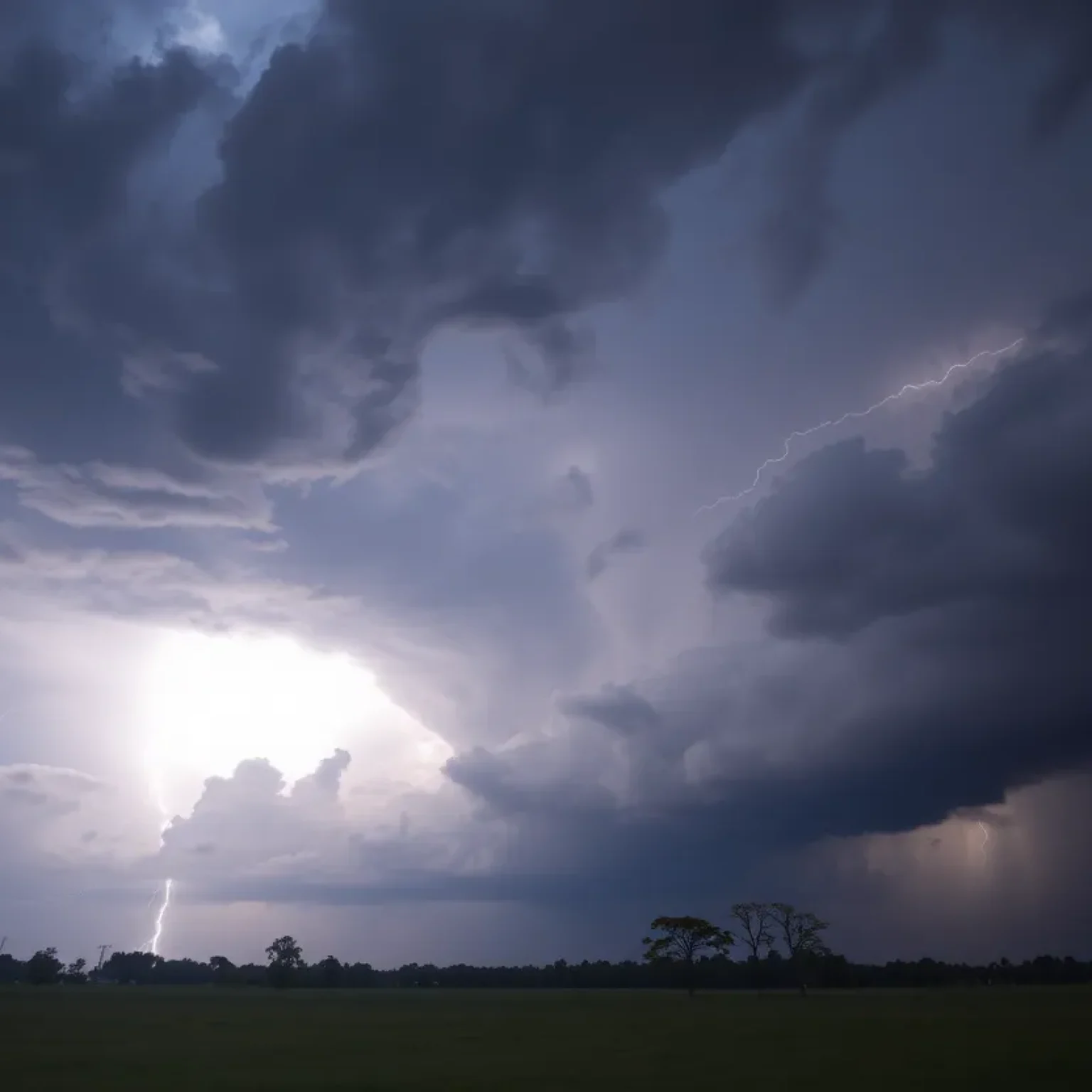 Dramatic storm clouds and lightning over Mississippi landscape